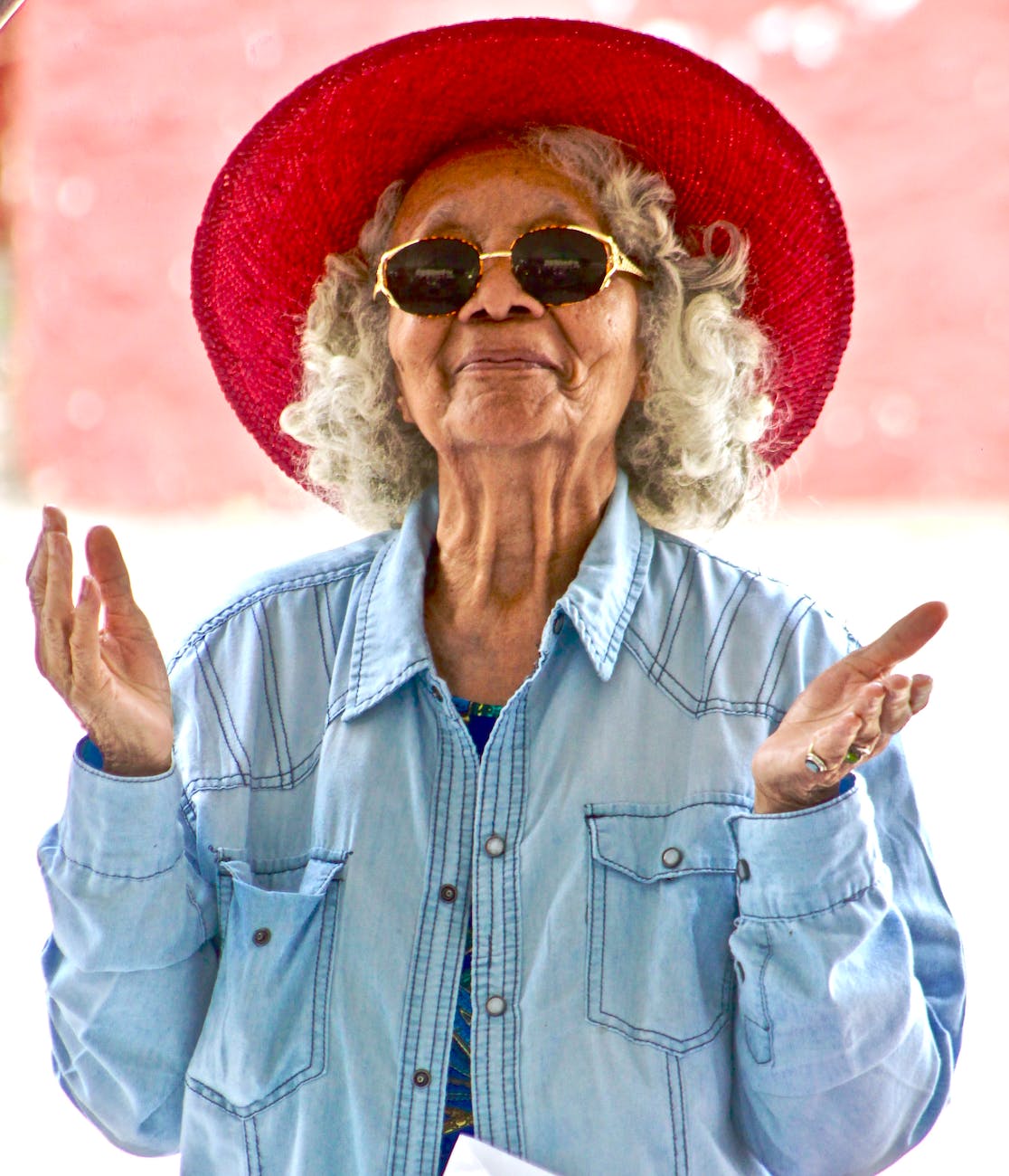 woman wearing red hat and sunglasses