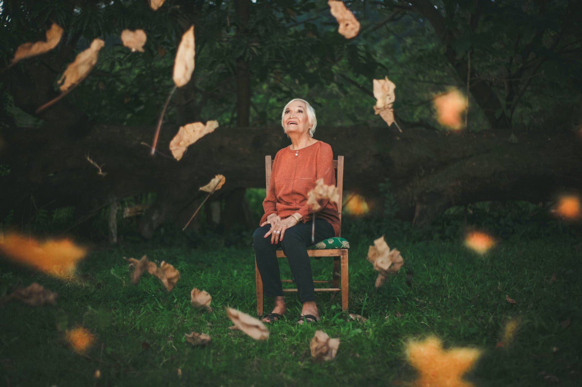 woman sitting on chair while looking upwards